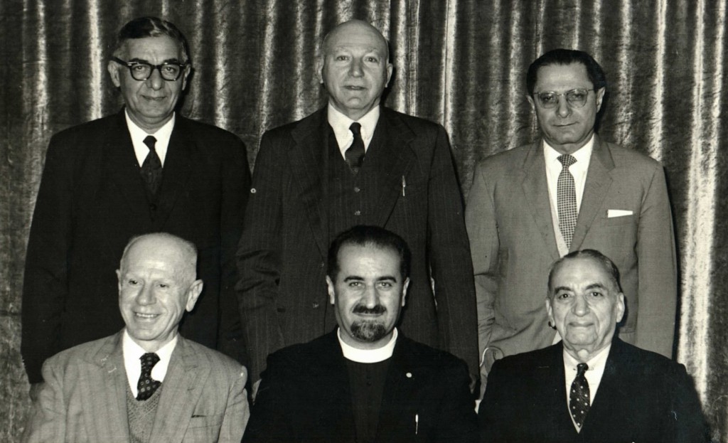 Vahan Hannesian [Secretary], Father Aramais Mirzayan, Mac Hagopian [Chairman] Standing left to right – Nahapet M. Nahapet, E.A. Edgar, Armen Apkar [Treasurer]